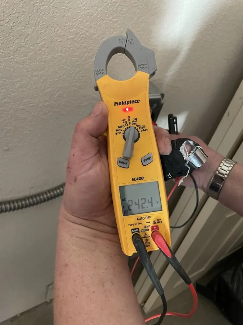 Voltage testing with clamp meter during Electrical Installation Services in Johnson City